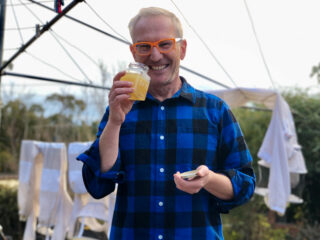 A man with a jar of honey